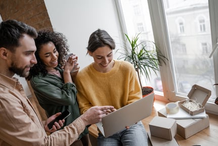 Young people infront of laptop shutterstock_1636505362-1